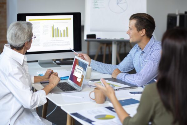 Three employees in the meeting room, Salesforce Technical Training