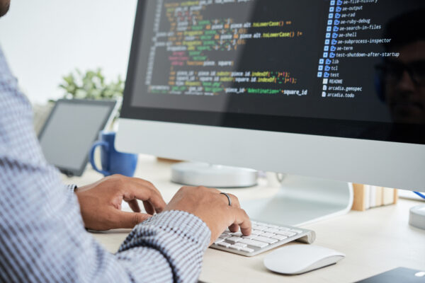 Cropped image of It specialist working on code, Salesforce Developer Training