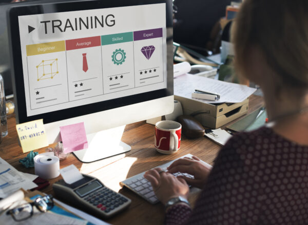 A woman checking on her computer, Salesforce Training Courses